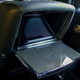 The fold-down rear table and screen of the 2023 Rolls-Royce Black Badge Ghost